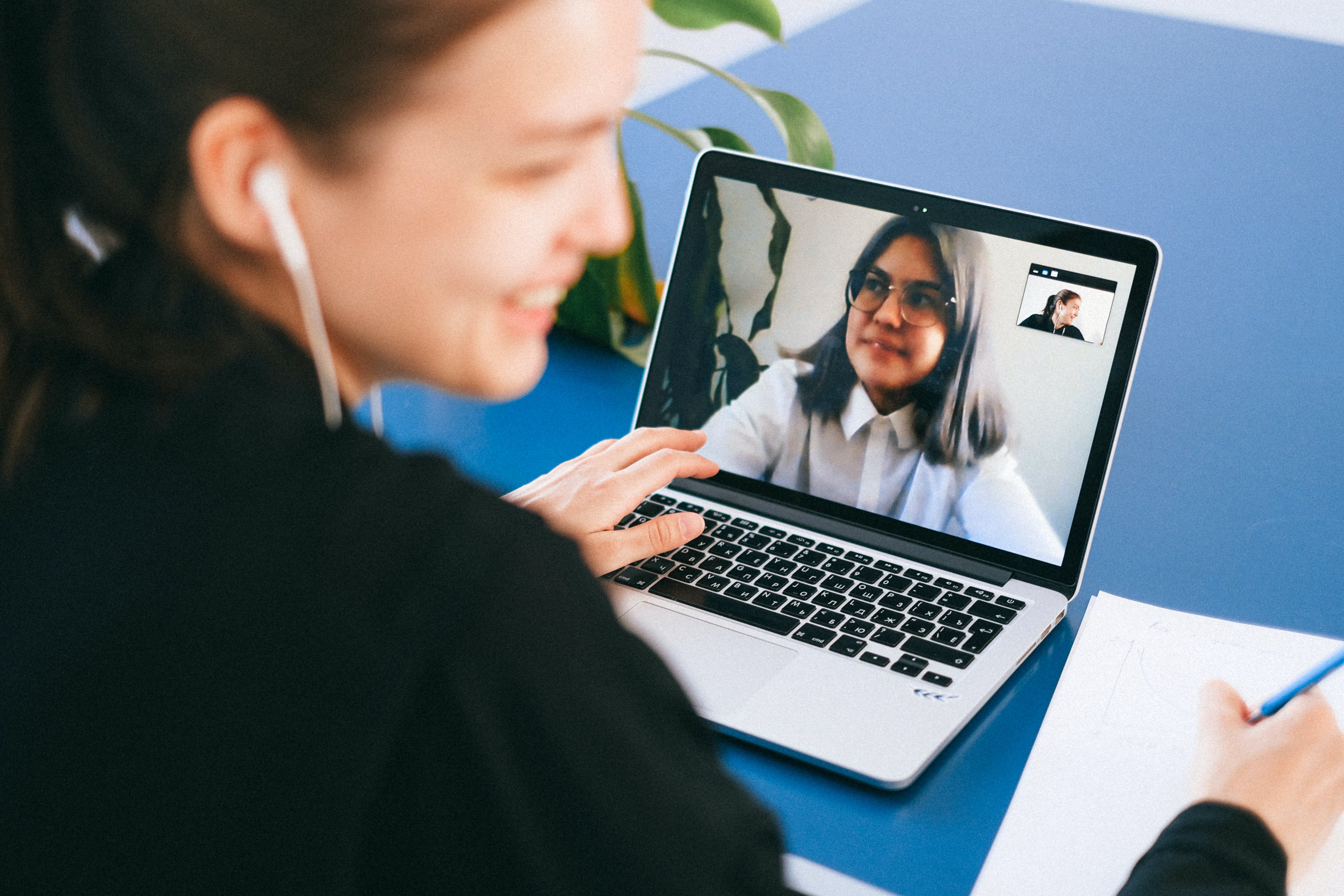 Woman on a video call with her offshore staff