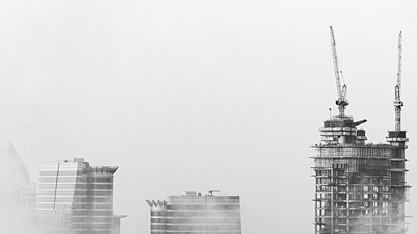 Construction of building on a foggy sky